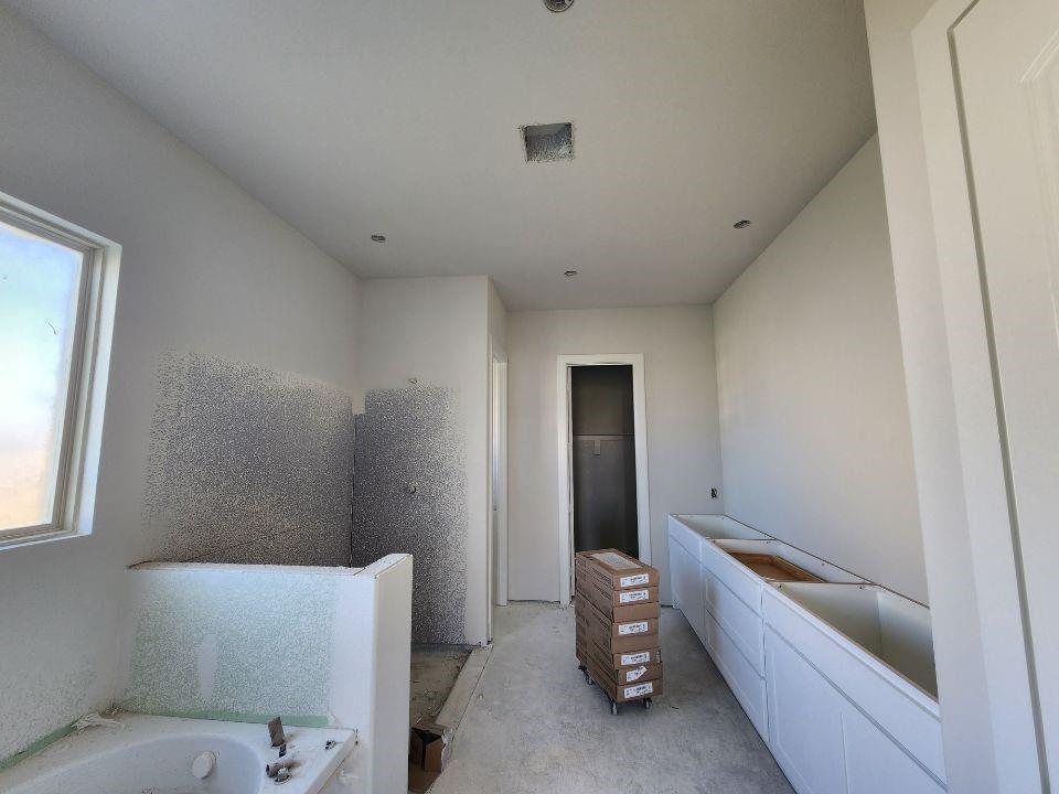 12412 Delta Court Krum, TX 76249 - Photo 16 of 18 a bathroom with a sink and bathtub