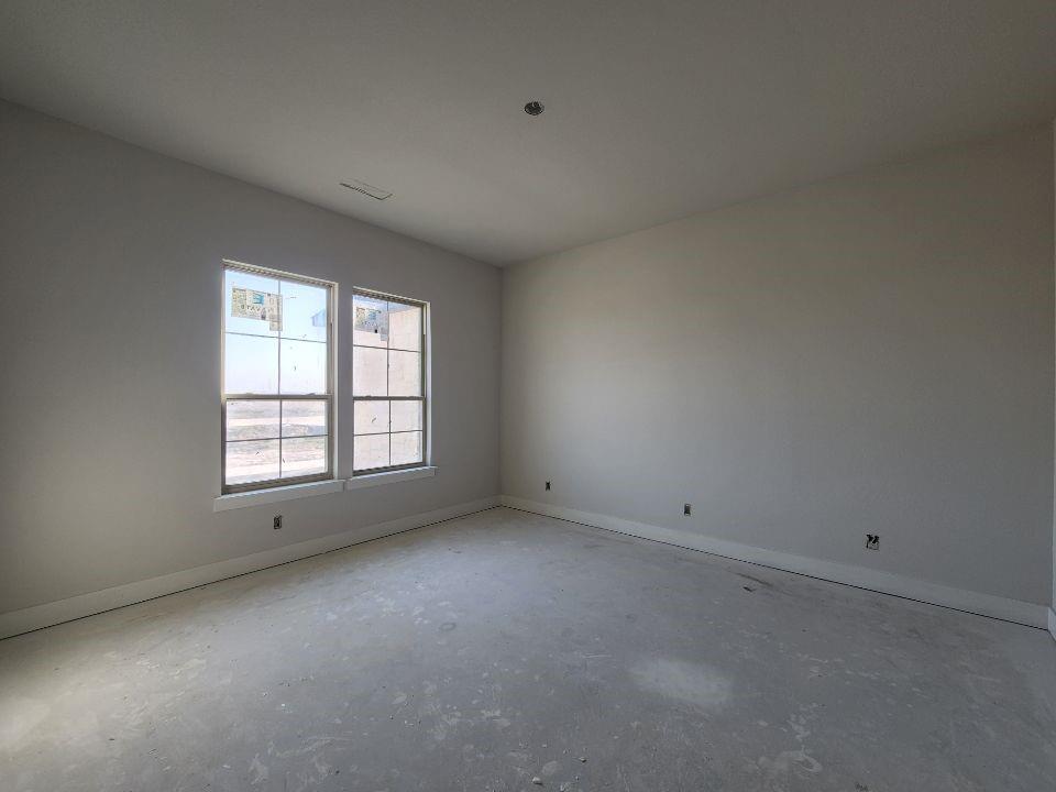 12412 Delta Court Krum, TX 76249 - Photo 4 of 18 an empty room with a window