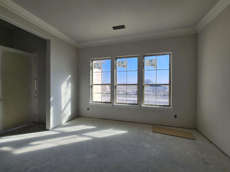 12412 Delta Court Krum, TX 76249 - Photo 5 of 18 an empty room with a empty space and windows