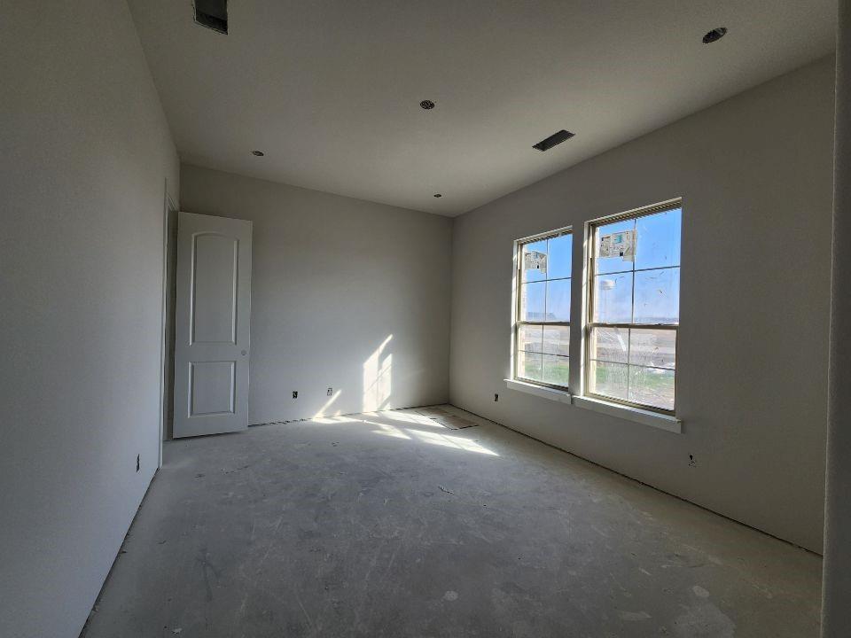 12412 Delta Court Krum, TX 76249 - Photo 6 of 18 a view of an empty room with a window
