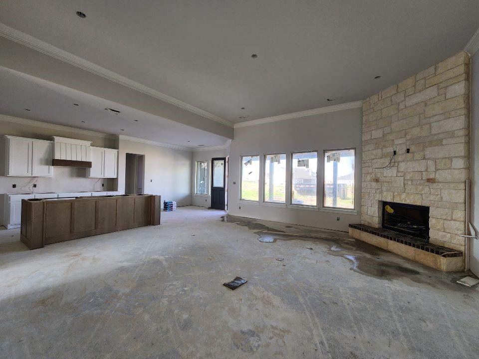 12412 Delta Court Krum, TX 76249 - Photo 7 of 18 a large bedroom with a large bed and a fireplace