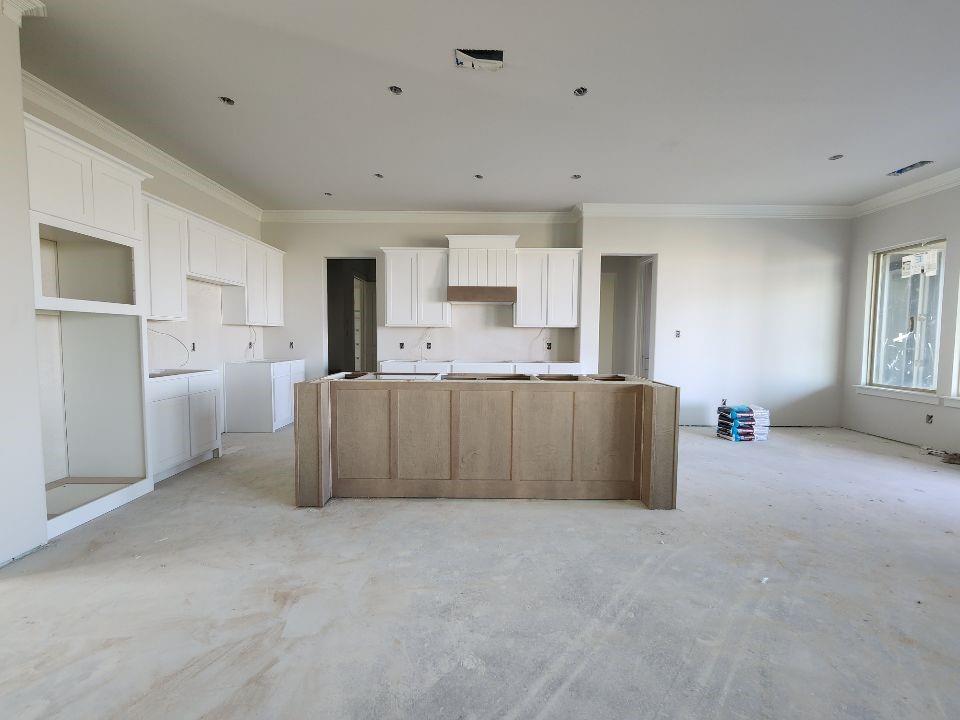 12412 Delta Court Krum, TX 76249 - Photo 8 of 18 a large kitchen with stainless steel appliances granite countertop a refrigerator and a stove