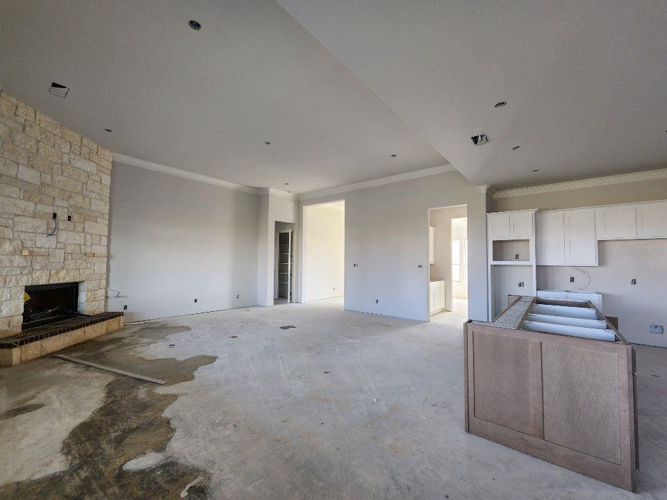 12412 Delta Court Krum, TX 76249 - Photo 9 of 18 a view of an empty room with a fireplace