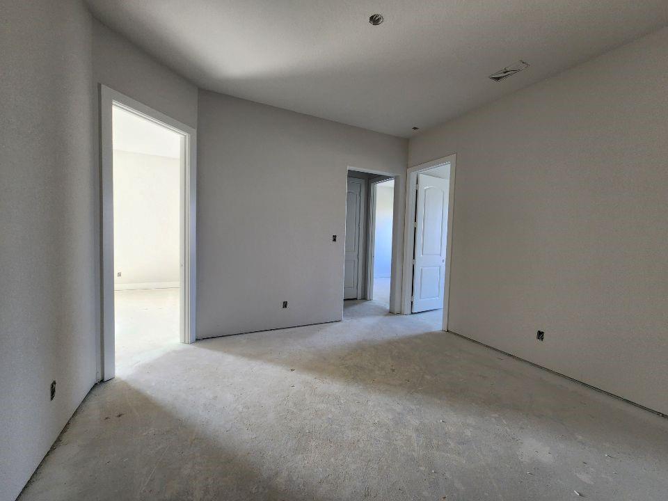 12412 Delta Court Krum, TX 76249 - Photo 10 of 18 an empty room with windows and closet