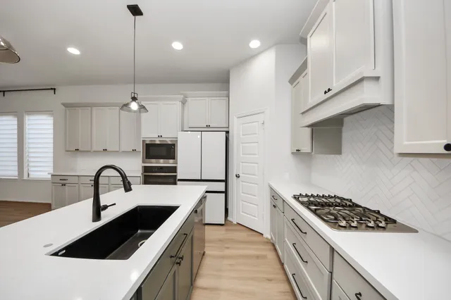 a bathroom with a sink a vanity and a mirror