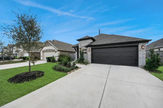 a front view of house with garden