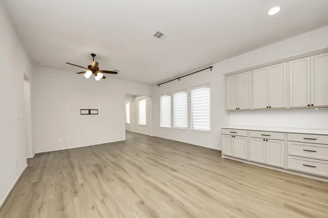 a kitchen with a stove a sink and a refrigerator
