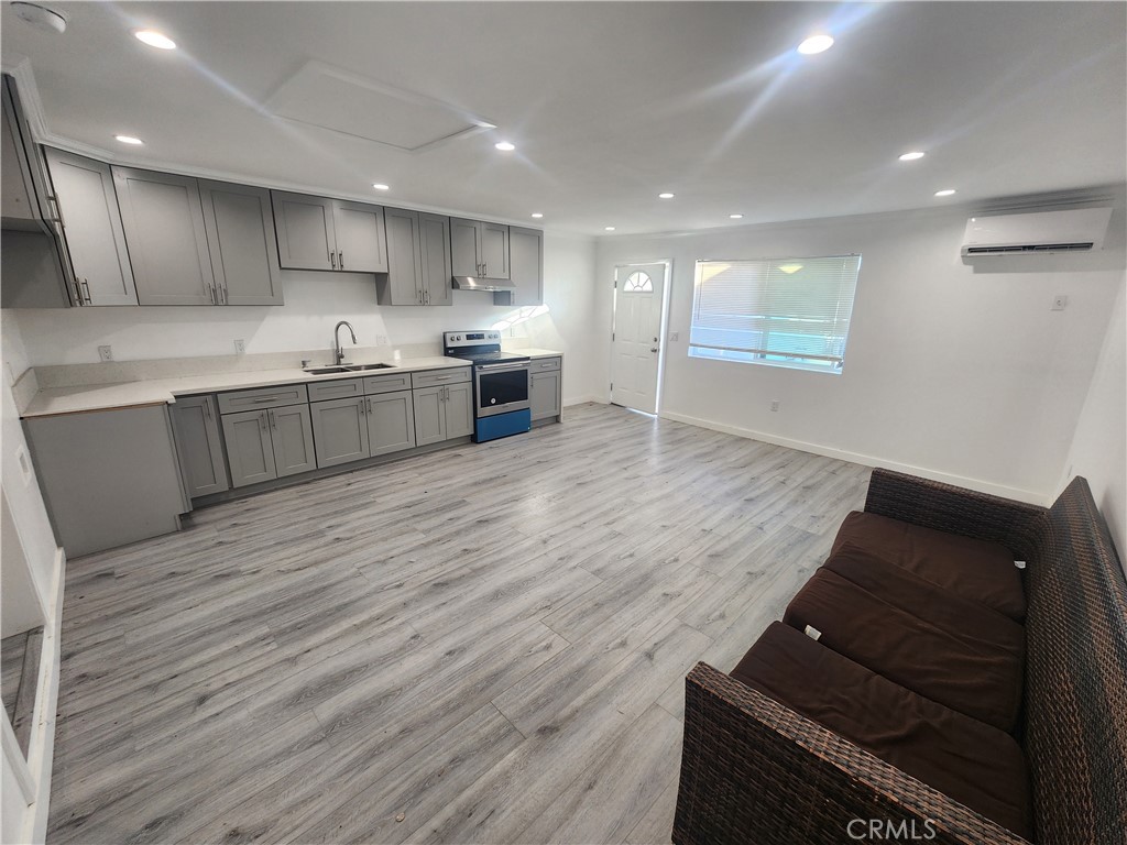 a kitchen with stainless steel appliances granite countertop a stove and a refrigerator