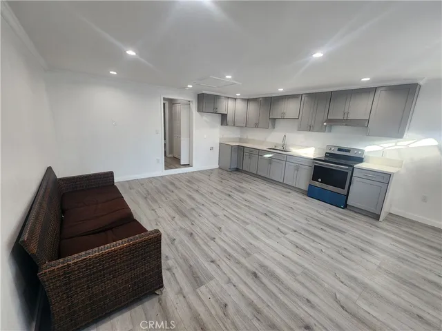 a kitchen with stainless steel appliances granite countertop a stove and a sink