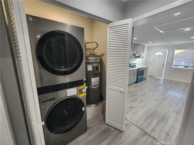 a view of a hallway with washer and dryer