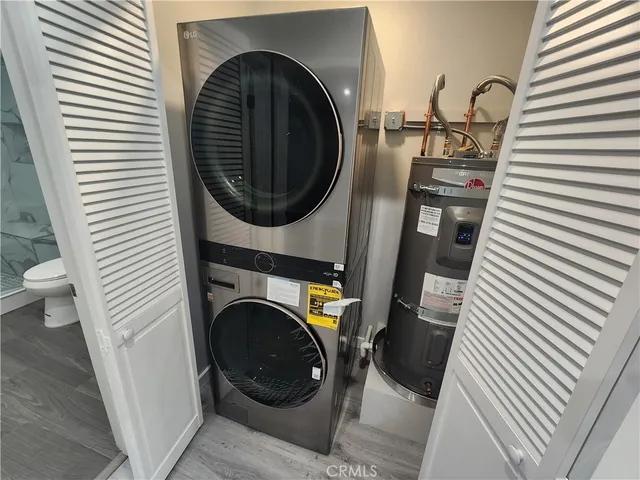 a close view of a utility room with dryer and washer