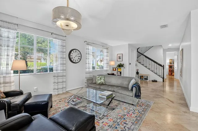 a bathroom with a sink and mirror with toilet