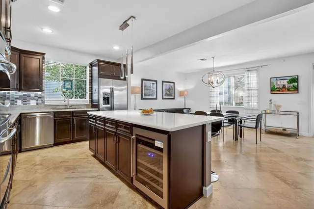 a spacious bathroom with a tub sink and mirror