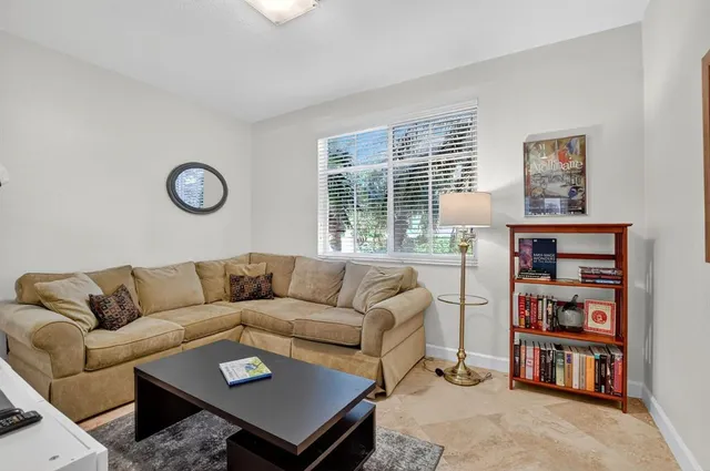 a bedroom with furniture and a book shelf