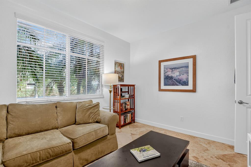 591 Northwest Library Commons Way Boca Raton, FL 33432 - Photo 36 of 75 a living room with furniture and a window