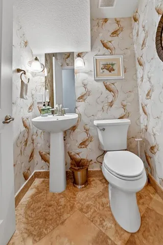 a living room with furniture and a book shelf