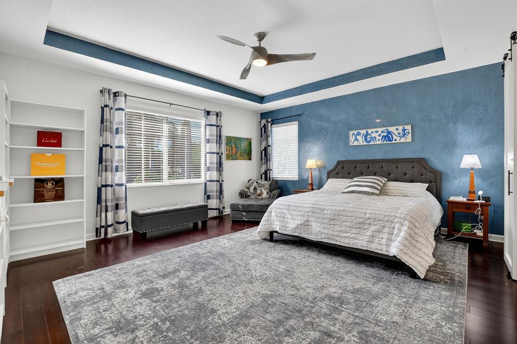 591 Northwest Library Commons Way Boca Raton, FL 33432 - Photo 41 of 75 Gorgeous primary bedroom with Venetian Plaster accented wall.