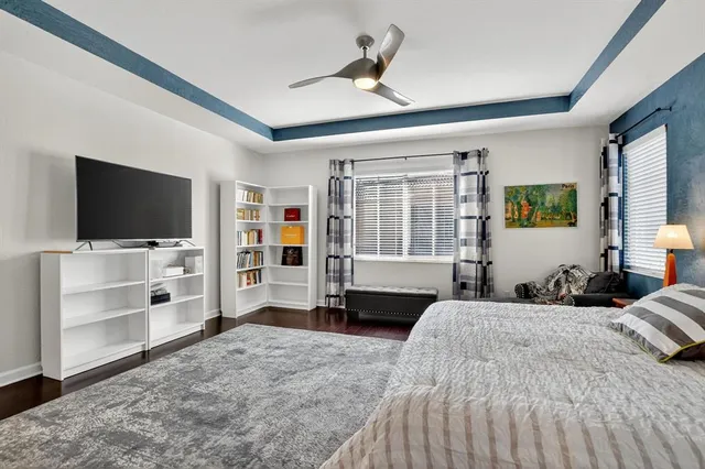 an aerial view of residential houses with outdoor space and river