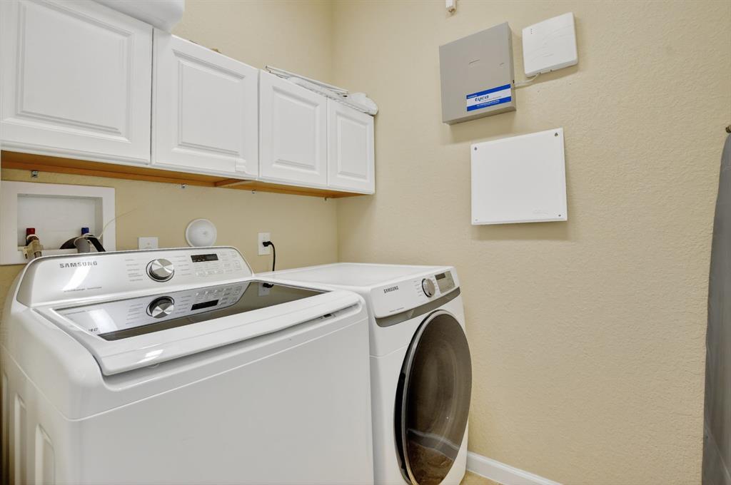 591 Northwest Library Commons Way Boca Raton, FL 33432 - Photo 53 of 75 a utility room with dryer and washer