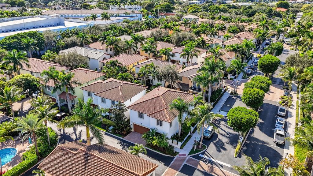 591 Northwest Library Commons Way Boca Raton, FL 33432 - Photo 73 of 75 an aerial view of multiple houses with yard
