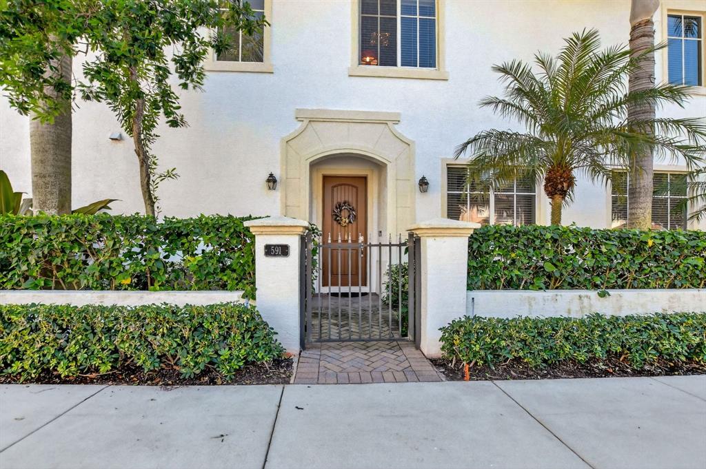 591 Northwest Library Commons Way Boca Raton, FL 33432 - Photo 10 of 75 front view of a house with a garden