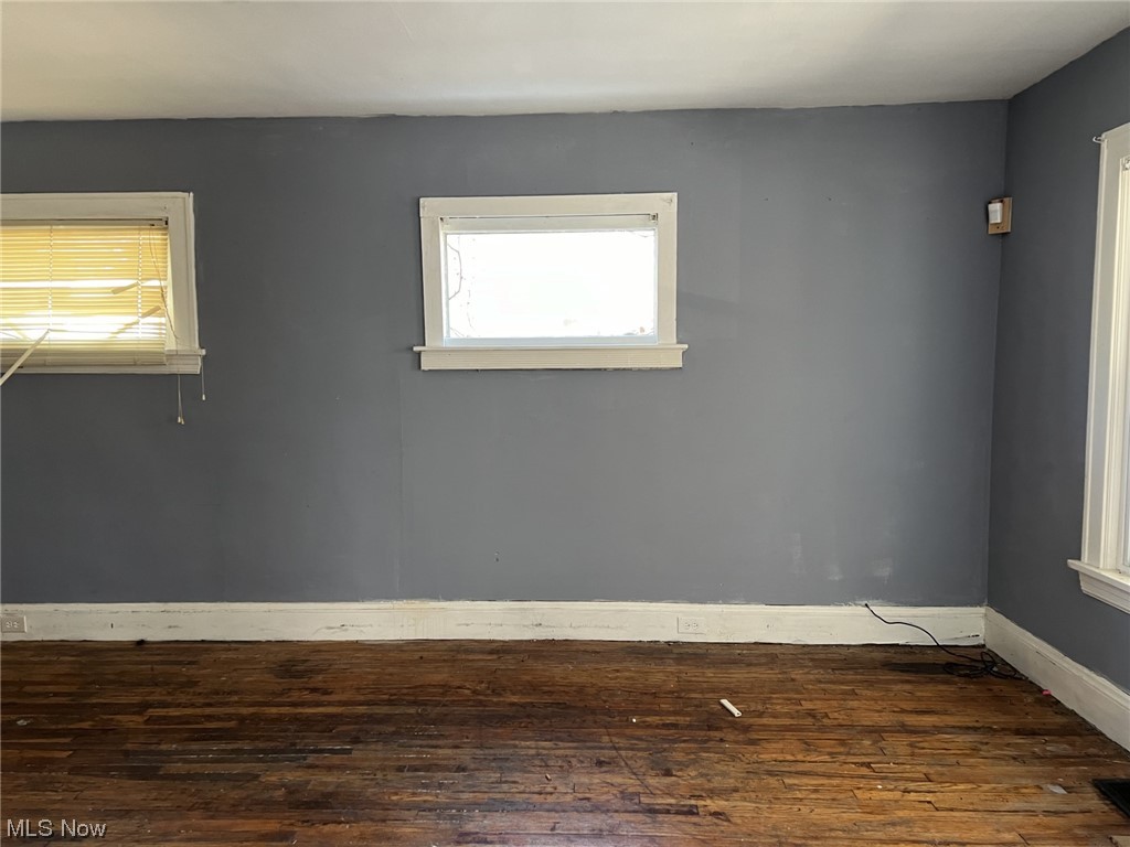 14740 Wemple Road Cleveland, OH 44110 - Photo 5 of 11 Spare room with dark hardwood / wood-style flooring