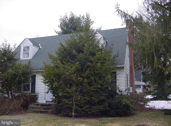 8814 Liberty Road Randallstown, MD 21133 - Photo 1 of 5 a view of a house with a yard and potted plants