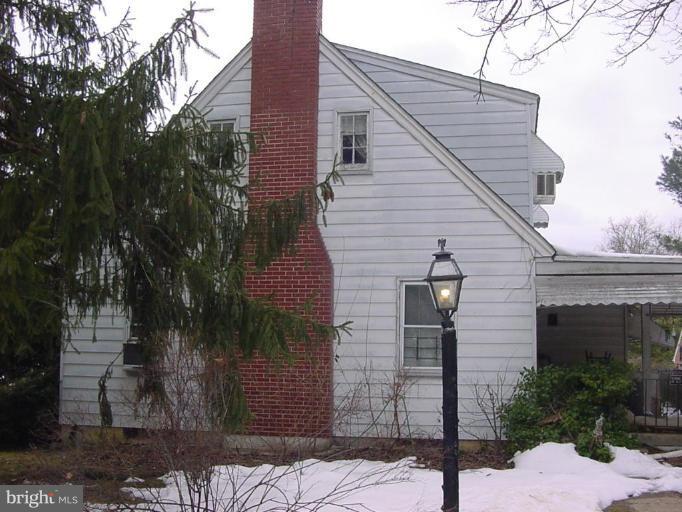 8814 Liberty Road Randallstown, MD 21133 - Photo 2 of 5 a front view of a house with garage