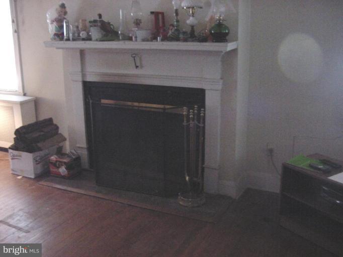 8814 Liberty Road Randallstown, MD 21133 - Photo 5 of 5 a close view of a fireplace in the room