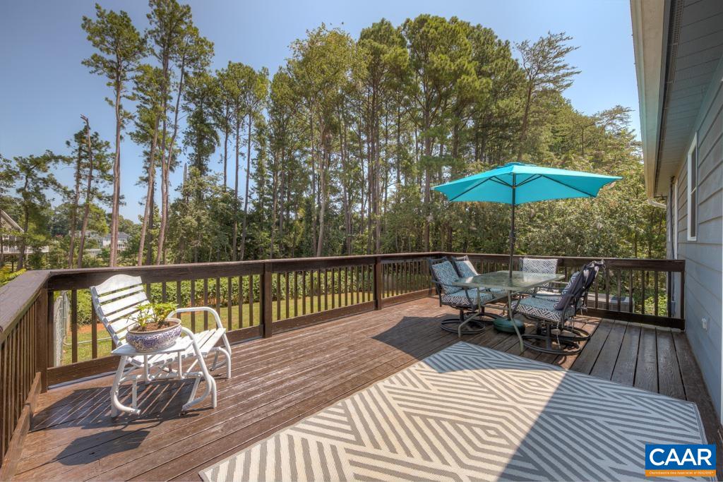 235 Spring Oaks Lane Ruckersville, VA 22968 - Photo 17 of 44 a view of a deck with furniture and wooden floor