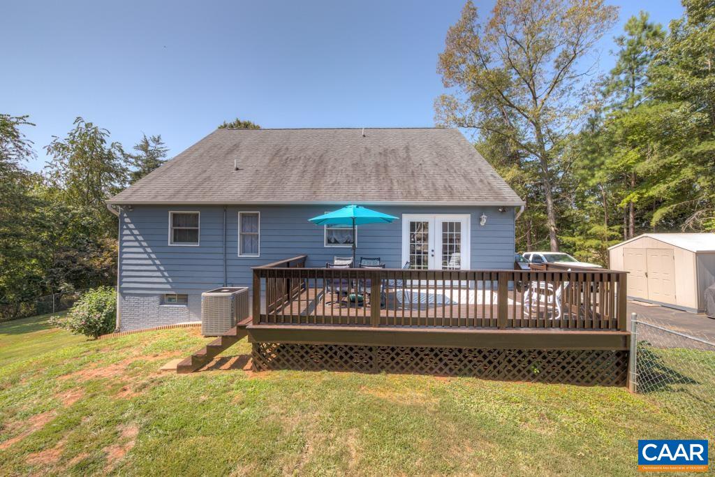 235 Spring Oaks Lane Ruckersville, VA 22968 - Photo 21 of 44 a view of a house with a yard and a garden