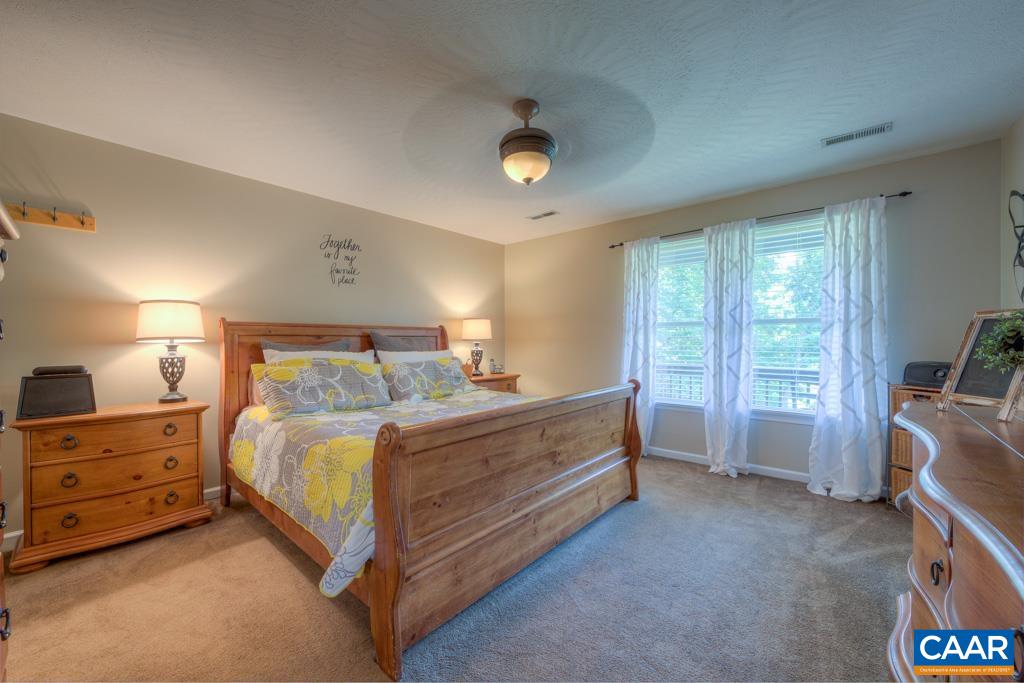 235 Spring Oaks Lane Ruckersville, VA 22968 - Photo 23 of 44 a bed room with a bed and a window