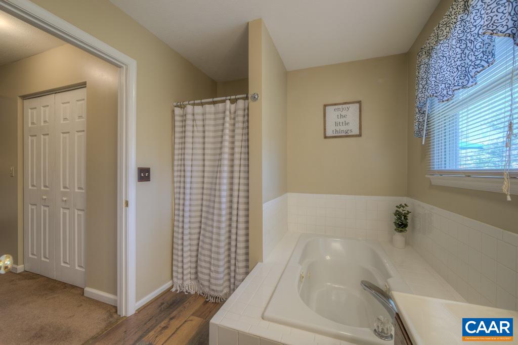 235 Spring Oaks Lane Ruckersville, VA 22968 - Photo 32 of 44 a bathroom with a bathtub and shower