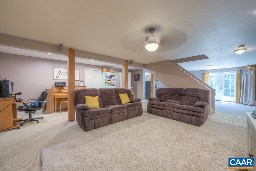 235 Spring Oaks Lane Ruckersville, VA 22968 - Photo 34 of 44 a living room with furniture and a couch