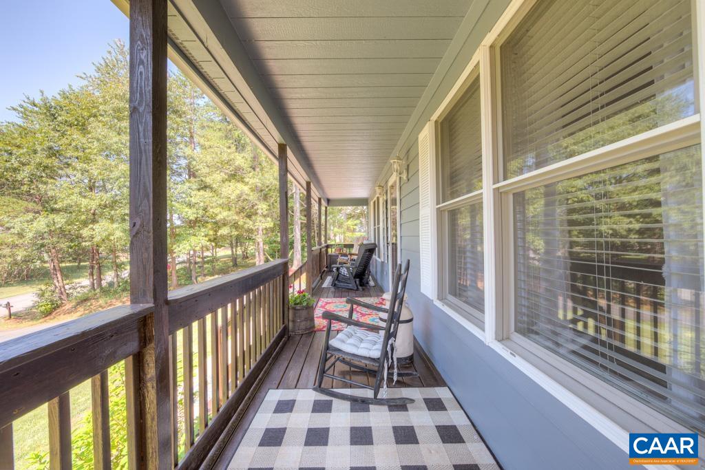 235 Spring Oaks Lane Ruckersville, VA 22968 - Photo 4 of 44 a view of a large room with wooden floor and windows