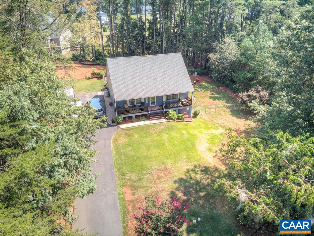 235 Spring Oaks Lane Ruckersville, VA 22968 - Photo 41 of 44 a view of a swimming pool with a patio and a yard