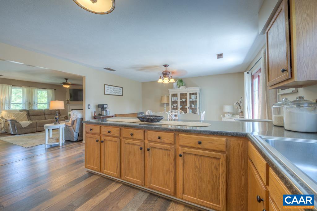 235 Spring Oaks Lane Ruckersville, VA 22968 - Photo 10 of 44 a large kitchen with lot of cabinets and wooden floor