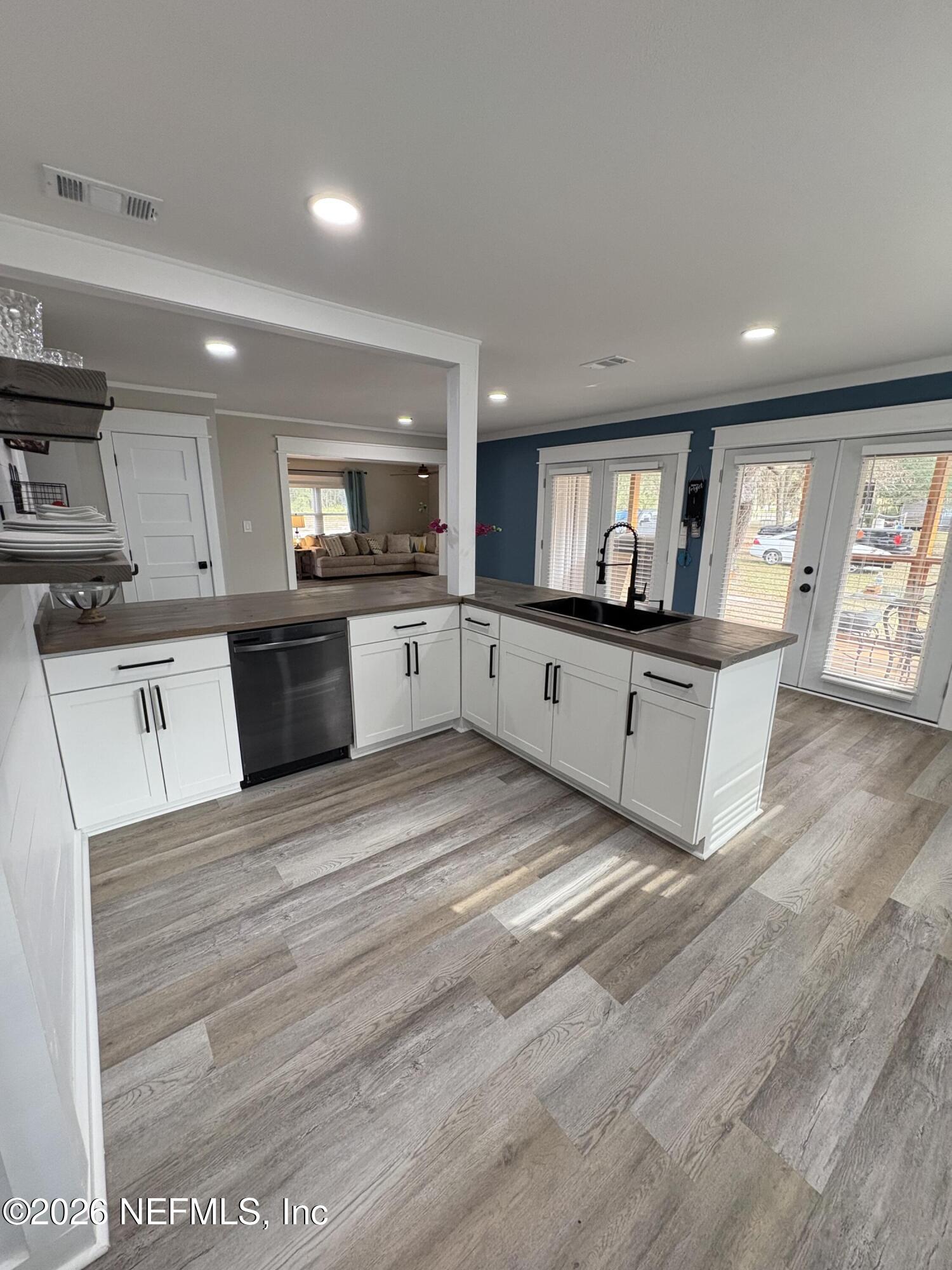 165 Fulton Road Palatka, FL 32177 - Photo 13 of 26 a large kitchen with stainless steel appliances granite countertop a stove and a sink