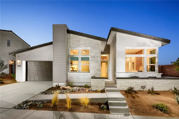 a front view of a house with a outdoor space