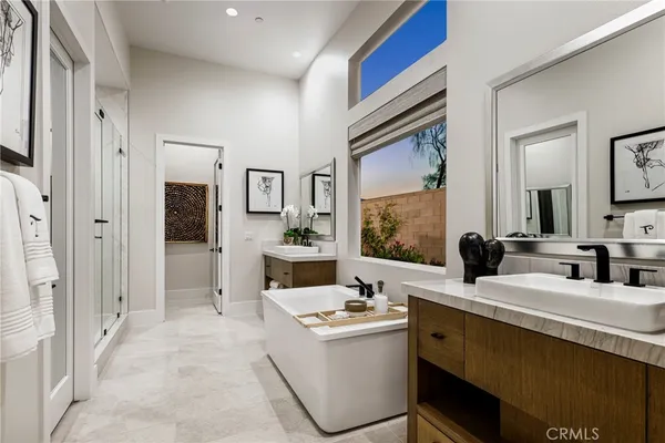 a bathroom with a sink a mirror and a bathtub