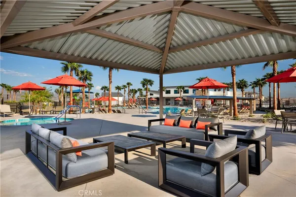 a view of a chairs and table in a patio
