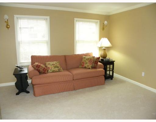 203 East Harbison Road Pittsburgh, PA 15205 - Photo 3 of 18 Living Room. The living room is very neutral with crown molding and wall to wall carpet.