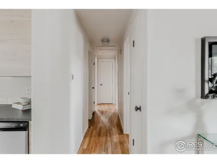 a bedroom with a bed and a night stand