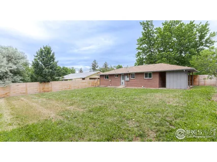 a open area with trees in the background
