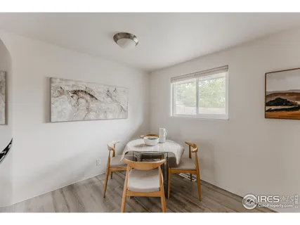 a dining room with a table and chairs