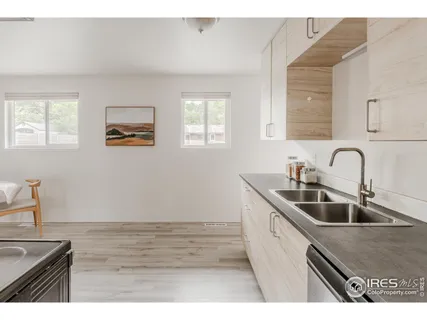 a kitchen with a sink and cabinets