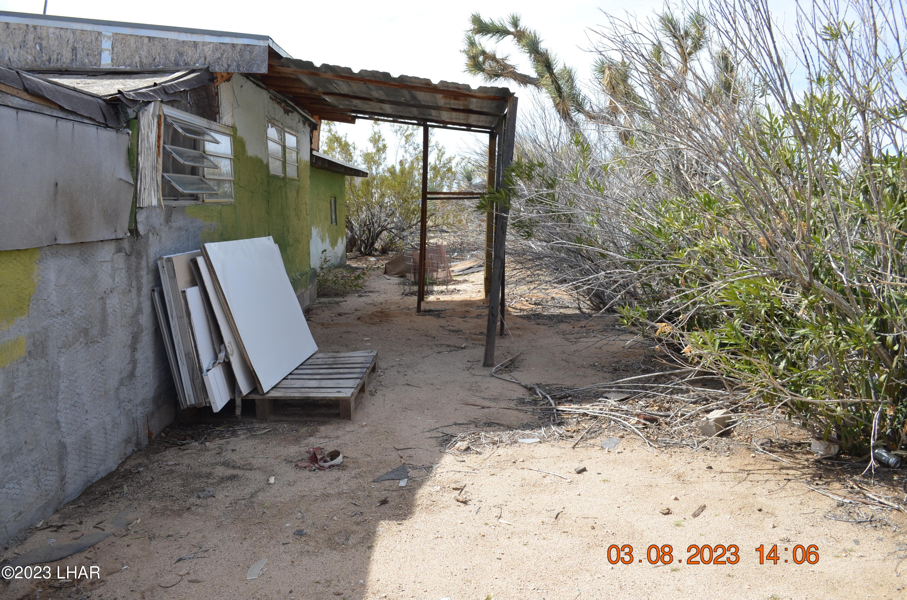 11841 Carrow Road Yucca, AZ 86438 - Photo 16 of 17 Back of Fixer Upper