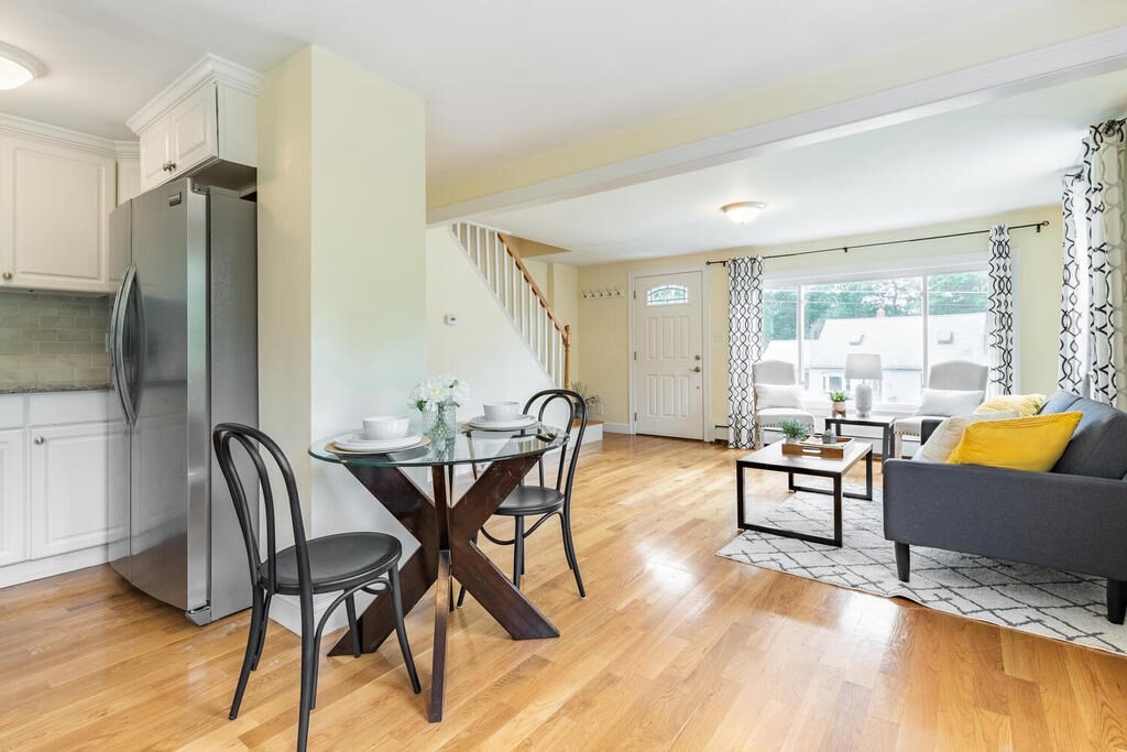 18 Woodbury Road Billerica, MA 01821 - Photo 16 of 30 a view of a dining room with furniture and wooden floor