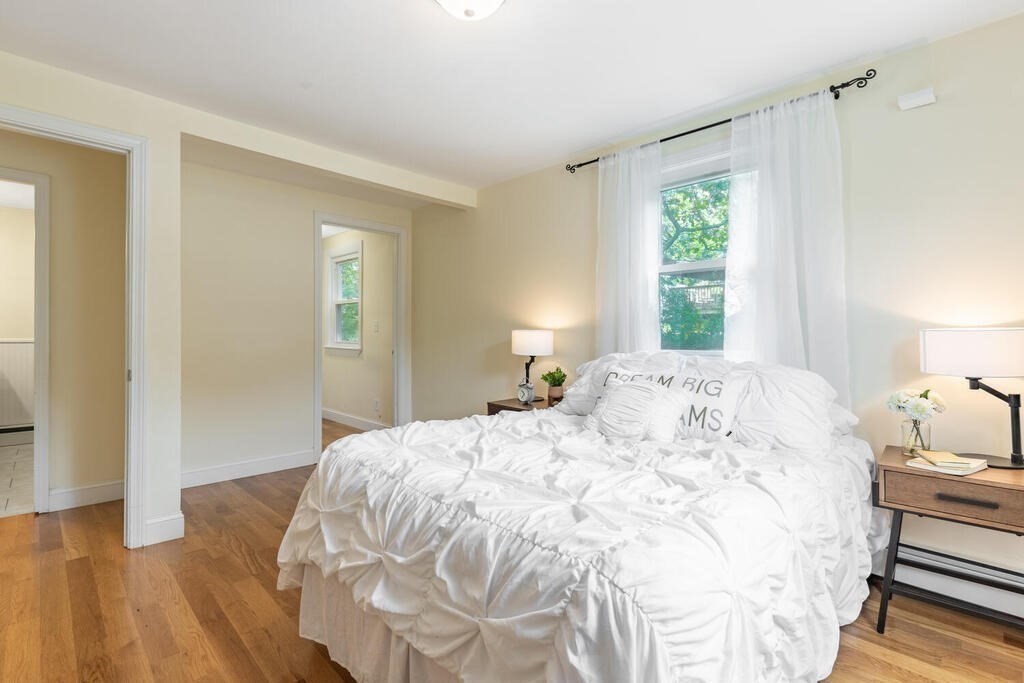 18 Woodbury Road Billerica, MA 01821 - Photo 17 of 30 a bedroom with a bed and a window