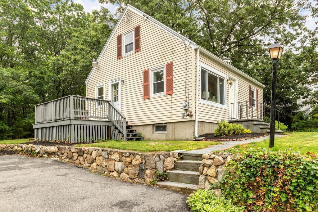 18 Woodbury Road Billerica, MA 01821 - Photo 2 of 30 a front view of a house with a garden